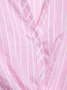 Detail of pink and white vertical striped V-neckline with delicate white buttons