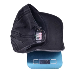 Vintage washed charcoal baseball cap with cherry embroidery weighing 75g on a scale