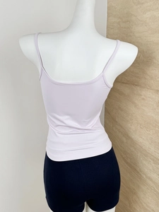 Detail view of the back of a slim fit light purple camisole with thin shoulder straps