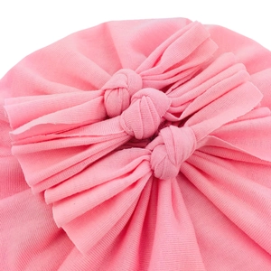 Pink soft cotton baby hat featuring three elegant knotted bows and pleated details
