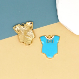 Detail of blue enamel and golden textured baby bodysuit charms for DIY jewelry making