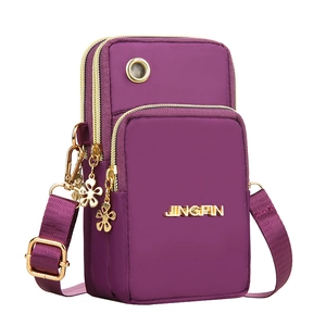 Purple nylon multi-layer crossbody phone bag with gold hardware and headphone jack