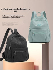 Detail view of large capacity waterproof nylon backpacks in black and mint green colors