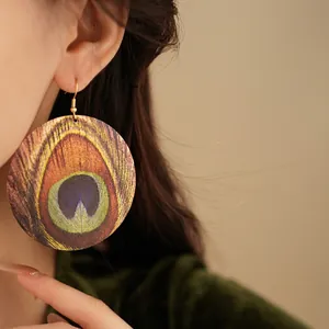 Bohemian round earrings with peacock feather pattern and vintage golden hooks