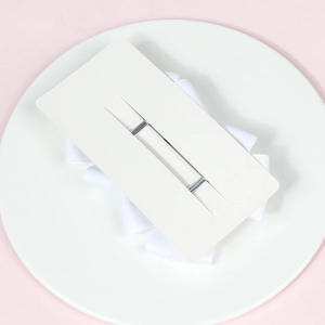 Detail of white grosgrain ribbon hair bows on display card for girls hair accessories