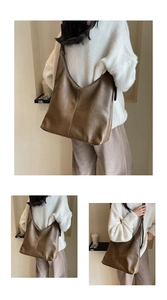 Detail view of large brown soft leather tote bag showing slouchy texture and casual style