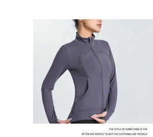 Detailed view of women's sports jacket featuring heart-shaped ruffles and thumb holes