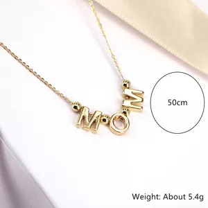 Detail of gold Mama necklace on white box with 50cm length and 5.4g weight specs