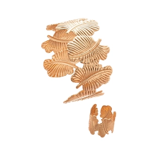 Two-piece gold palm leaf open bangle and matching ring set with detailed tropical texture