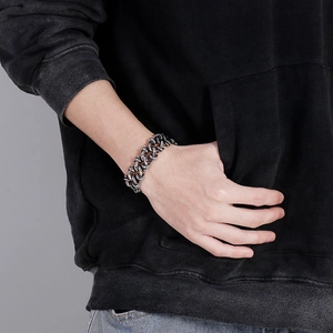 Close-up of men's chunky stainless steel chain bracelet with a vintage silver finish
