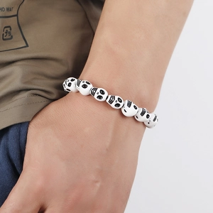 Retro white skull bead bracelet for men and women on wrist, gothic style accessory