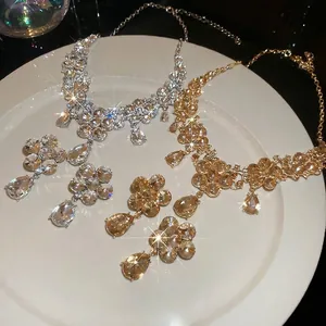 Luxury flower teardrop jewelry set with necklace and earrings in silver and gold finish