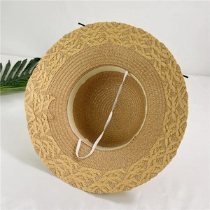 Foldable women's flower straw sun hat with woven texture and white elastic strap