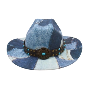 Detail of vintage patchwork denim cowboy hat with turquoise studs and engraved buckle
