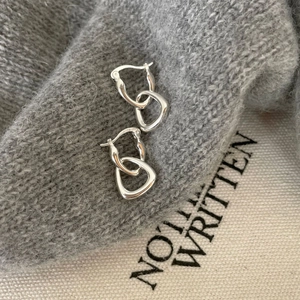S925 sterling silver hoop earrings with irregular heart and geometric links on a sweater