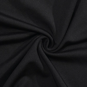 Vue macro détaillée de la texture du tissu tricoté noir extensible de qualité supérieure