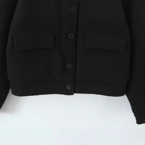 Women's black chunky knit jacket with long sleeves, stand collar and buttons