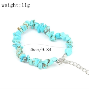 Detail of adjustable turquoise chip stone bracelet with silver lobster clasp and extender