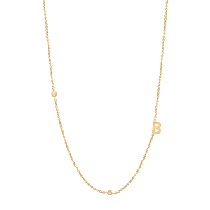 Detail of gold S925 silver necklace featuring a letter B pendant with sparkling crystals