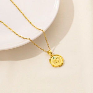 Golden stainless steel necklace with engraved handprint and footprint pendant and blue zircon