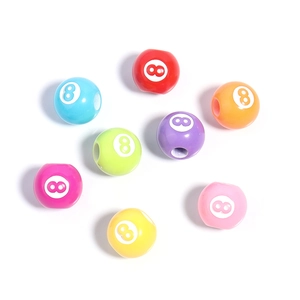 Close-up of colorful acrylic round beads with white number 8 for DIY jewelry making