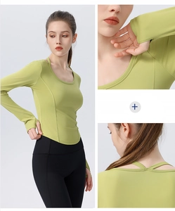 Detail view of avocado green yoga top featuring U-neck, thumbholes and cross back design