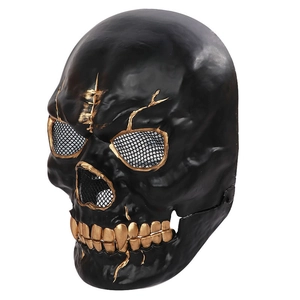 Detail of Halloween skull mask featuring gold crackle patterns and black mesh eyes