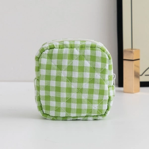 Green and white checkered sanitary napkin storage bag with diamond quilting and zipper