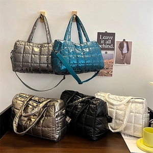 Glossy quilted puffer tote bags in metallic gray, teal, and silver with square pattern
