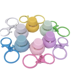 Colorful mechanical switch fidget toy keychains in seven vibrant plastic colors