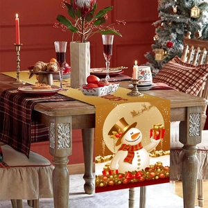 Christmas table runner with snowman and reindeer patterns for festive holiday dining decor