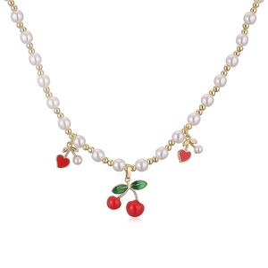 Elegant pearl and gold bead necklace with red cherry and heart pendants for women