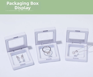 Three white PE film floating display boxes showing storage for earrings and rings