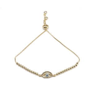 Bracelet œil porte-bonheur doré ajustable avec cristal bleu et perles de zircon