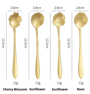 Detailed view of four golden flower-shaped stainless steel spoons with 12.5cm length