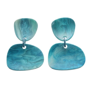 Blue marble resin drop earrings featuring irregular geometric shapes and silver needles