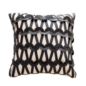 Luxury modern black leather woven throw pillow cover with minimalist white fabric background