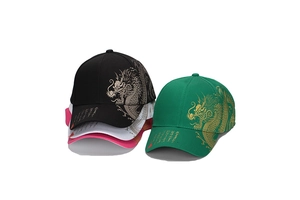 Detailed close-up of golden dragon embroidery and calligraphy on canvas baseball caps