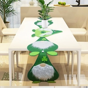 Close-up of a green St. Patrick's Day gnome table runner with clover patterns and plush beard