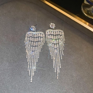 Detailed view of silver flower tassel earrings with shimmering cubic zirconia crystals