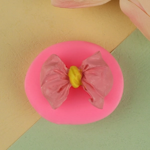 Pink 3D bow silicone fondant mold for DIY baking and chocolate crafting projects