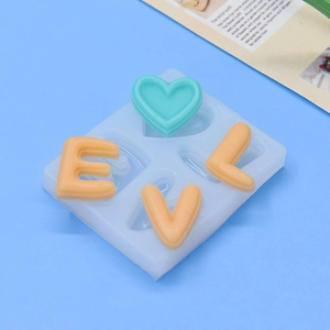 Silicone LOVE letter mold for DIY cake baking featuring heart shapes and orange letters