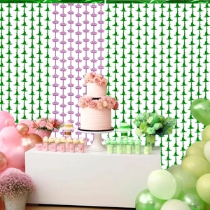 Pink and green party backdrop with balloons and witch hat theme for birthday events