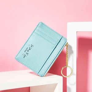 Blue Saffiano leather card holder with gold keychain and multiple slots for cards