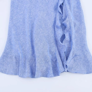 Elegant blue layered dress with tiered ruffles and linen texture for a fashionable look