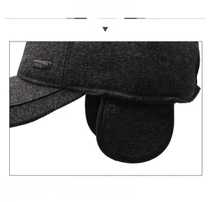 Detail view of winter baseball cap with ear flaps and textured wool blend fabric