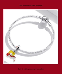 Macro detail of S925 sterling silver mesh bracelet with koi fish charm and family engraving