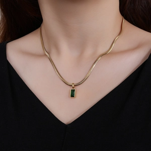 Elegant 18K gold-plated snake chain necklace with square emerald green gemstone pendant