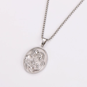 Macro view of silver family relief pendant with vintage oval embossed religious engraving