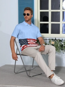 Detail of light blue men's polo shirt featuring American flag print on short sleeves